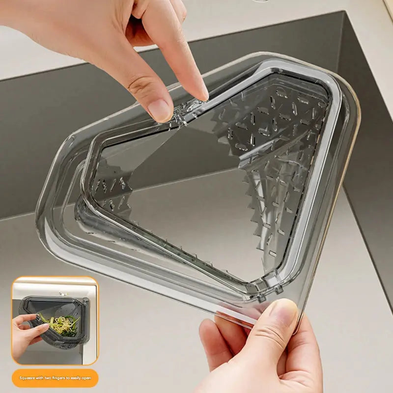 🔥MCOIKY® Magnetic draining triangular kitchen sink filter for storing food scraps, leftovers, and kitchen waste.